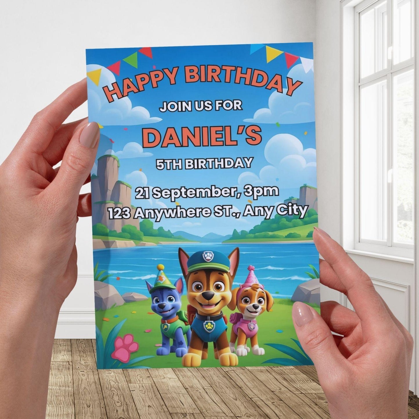 Paw Patrol birthday invitation editable showing hands holding Daniel 5th birthday invite with Chase and Skye by a lakeside