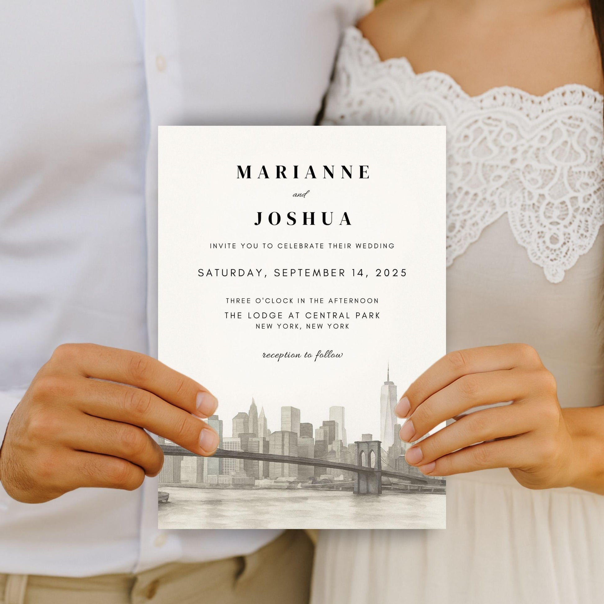 Best hand-illustrated wedding invitation template held by couple featuring city skyline and elegant text design