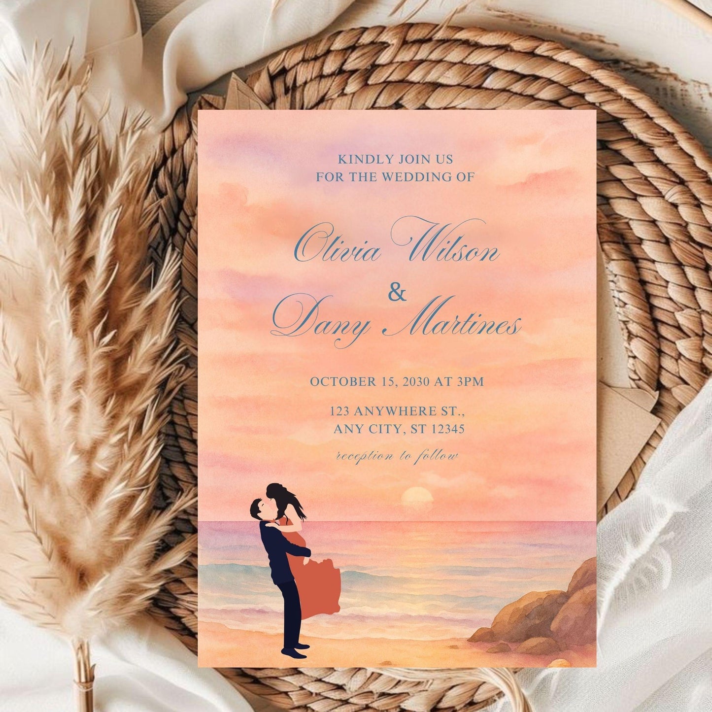 Editable sunset wedding invite template showing a couple embracing on the beach with soft peach and pink tones