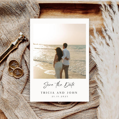 Minimalist wedding invitation template with a photo of a couple on the beach and elegant save the date text