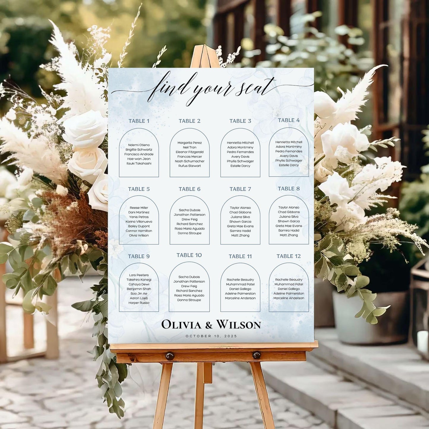 Elegant wedding seating chart template by ProCardist displayed on wooden easel with floral background